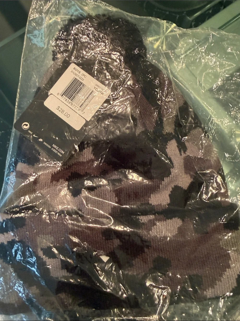 Nike Camo Black/Gray Knit Beanie with a black Pom-Pom. Black gloves to match.